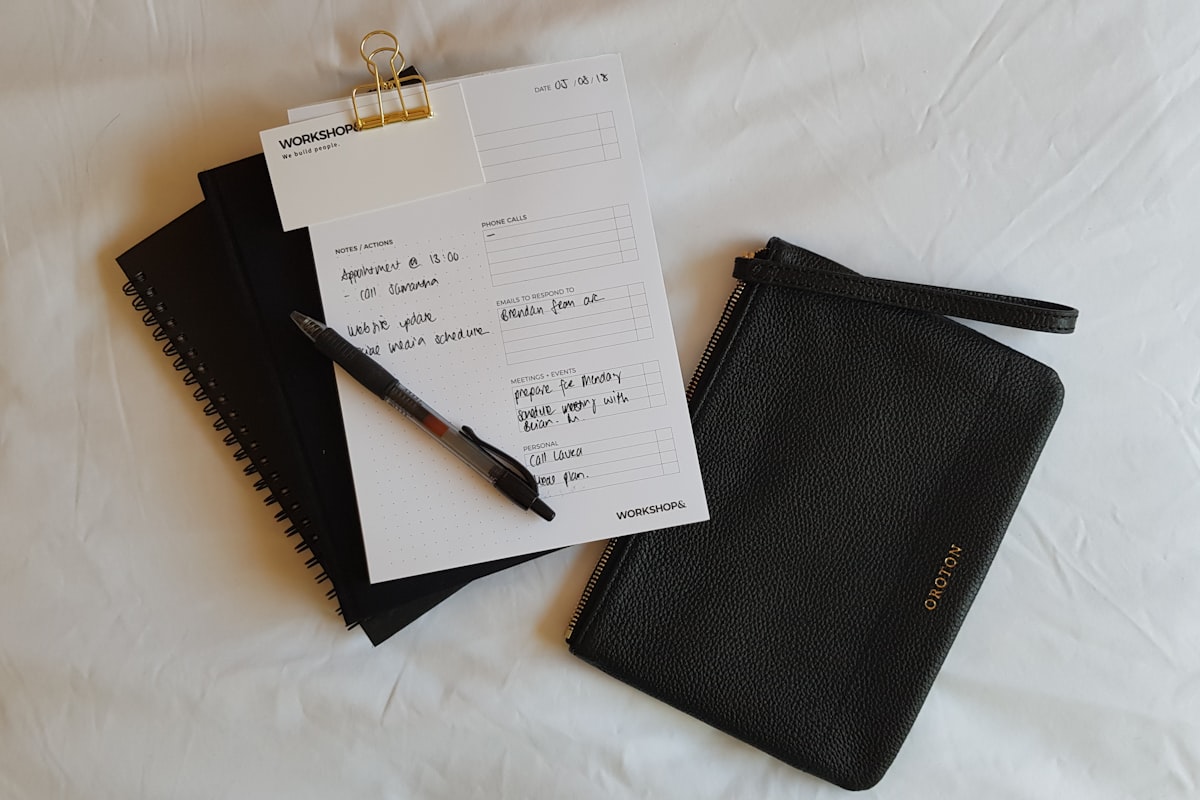 Digital nomad working at a desk with a budget spreadsheet