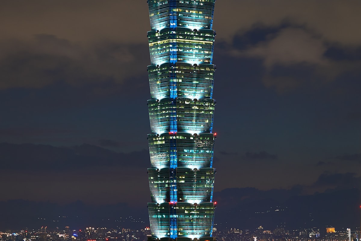 Taipei 101 tower with mountains in the background